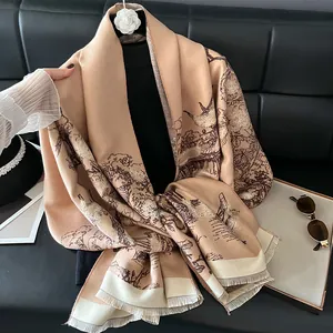 Detailed macro view of camel imitation cashmere scarf with vintage brown landscape prints