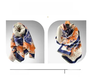 Detailed peony jacquard texture on navy and orange cashmere-like scarf with short tassels