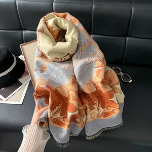 Detail of floral jacquard shawl with soft fringe and elegant vintage flower patterns