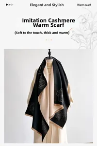 Detail of soft thick cashmere-like scarf with rose floral patterns and fringe tassels