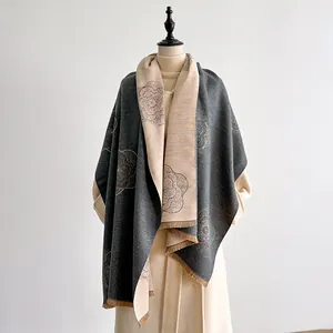 Close-up of double-sided jacquard scarf featuring camellia lines and tassel edges