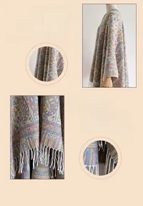 Close-up of vintage paisley pattern and tassel details on a thick knitted ethnic poncho