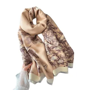 Classic beige cashmere-like scarf with vintage floral print and fringe details