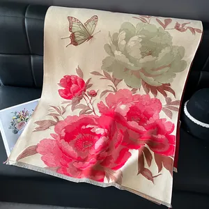 Detail view of floral shawl featuring elegant red peonies and fine fringe edges