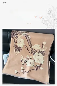 Detailed texture of thick cashmere-like scarf featuring plum blossom and bird jacquard
