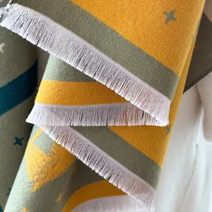 Thick yellow and grey plaid scarf with stars and white fringe for winter warmth