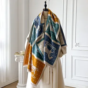 Detailed view of thick equestrian horse print scarf with tassel edges and color-block design
