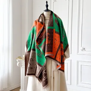 Detailed close-up of horse motif and geometric patterns on a luxury plaid shawl scarf