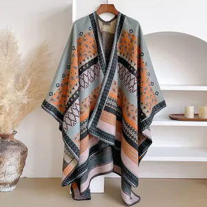 Close-up of bohemian knit shawl featuring intricate paisley and geometric patterns