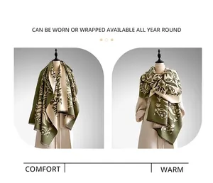 Detail view of olive green retro floral cashmere-like shawl with fine fringe edges