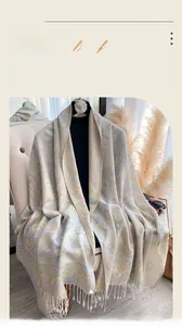 Detailed view of paisley pattern and soft fringe on the ethnic jacquard shawl scarf
