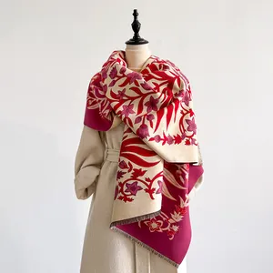 Close-up of vintage floral print cashmere-feel shawl scarf with delicate tassel edges