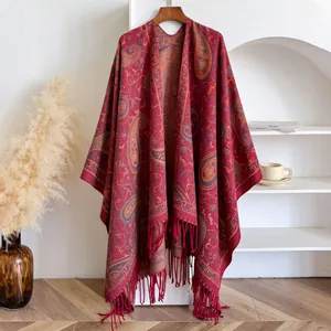 Ethnic paisley cashmere-like poncho shawl with tassels in deep red for travel