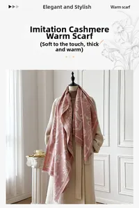 Close-up of floral jacquard pattern and fringe on soft pink cashmere-like scarf