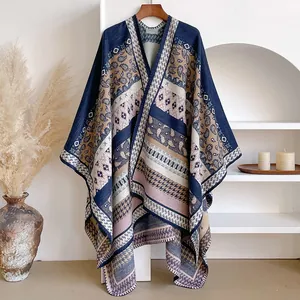 Detail of bohemian geometric paisley patterns on thick winter shawl with stitching