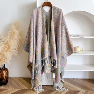 Ethnic paisley floral jacquard shawl with tassel fringe for women in cozy home setting