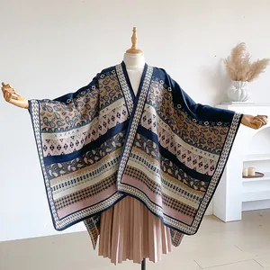Detail of bohemian knit shawl featuring intricate paisley and geometric ethnic patterns