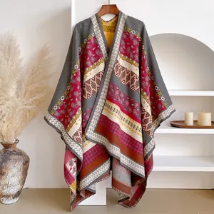 Detail of bohemian knit shawl featuring ethnic geometric patterns and tassels