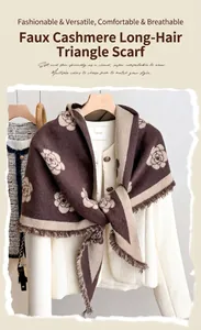 Detail of camellia pattern triangle shawl with fringe on luxury faux cashmere scarf