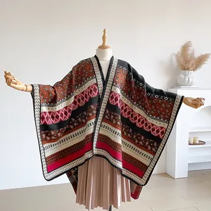 Close-up of bohemian poncho featuring geometric patterns and warm ethnic knit texture