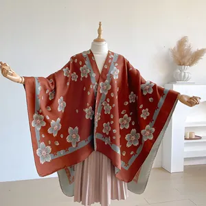 Vintage floral bohemian knitted poncho wrap in rust red with light blue cherry blossoms