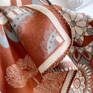 Bohemian oversized terracotta and light blue floral knit shawl with blanket stitch edges