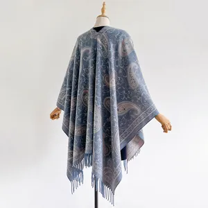 Ethnic paisley cashmere feel poncho for women in light blue and beige with elegant tassels