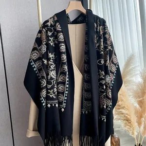 Elegant black embroidered cashmere-like shawl with vintage floral patterns and fringe details