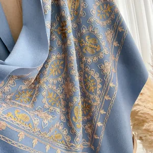 Light blue cashmere scarf with gold embroidery and tassels for autumn winter warmth