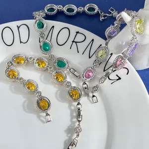 Elegant silver tennis bracelet set with oval cut colorful zircons and flower accents