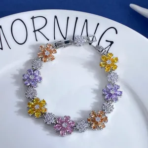 Detailed macro view of colorful zircon flower bracelet with pink and purple stones