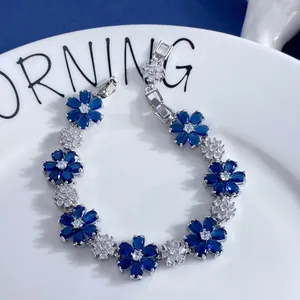 Detailed macro view of the blue marquise-cut gemstone flower bracelet with silver finish