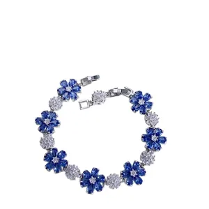 Elegant floral silver bracelet featuring sparkling blue and white zircon flower charms