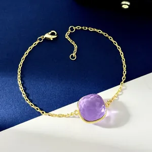 Detail showing the purple square gemstone on a golden chain with adjustable clasp