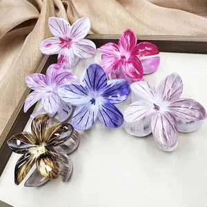 Pinze per capelli a forma di fiore di frangipane in colori perlati da donna