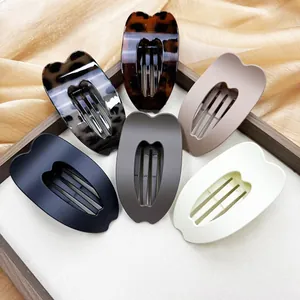 Detailed collection of minimalist heart-shaped hair claws in assorted matte and glossy finishes