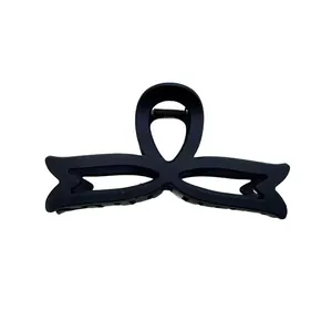Matte black oversized bow hair claw clip with vintage minimalist hollowed-out design