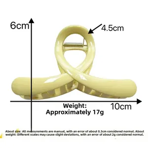 Hollow matte shark hair claw clip in pale yellow with dimensions 10cm x 6cm x 4.5cm