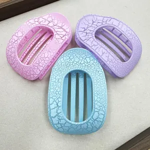 Detailed set of three ice-crack textured hair claw clips in pink, purple, and blue colors