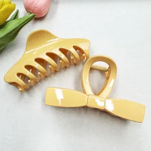 Set of cream yellow large hair claws with bow design and tulip flower decorations