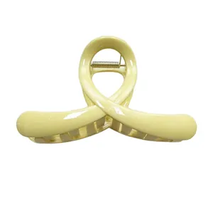 Minimalist cream hollow hair claw clip with golden metal spring for thick hair