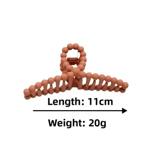 Matte coral 11cm hair claw clip with beaded chain design, weight 20g, side view detail