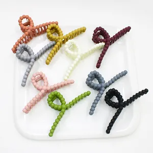 Matte candy color cross twist hair claw clips set in various vibrant pastel shades