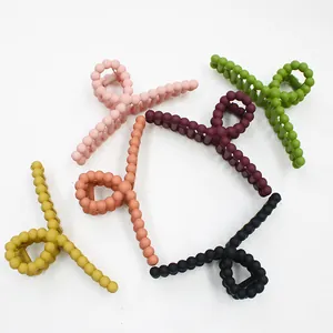 Matte candy colored hair claws in bead design with six trendy colors on white background