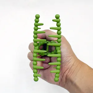 Detail of matte olive green hair claw clip showing sturdy spring and teeth