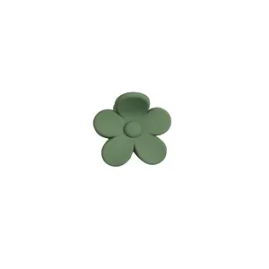 Elegant frosted flower hair claw clip in sage green finish with five-petal blossom design