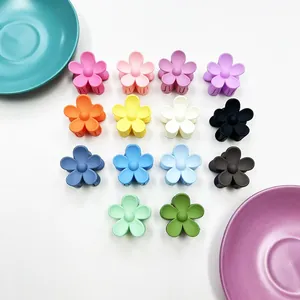 Matte finish small 3.5cm colorful macaron flower hair claws in a 14-piece multi-color set