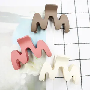 Set of 3 matte 9cm wave-shaped hair claw clips in coffee, pink, and cream white