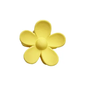 Bright yellow 3.5cm macaron flower hair claw clip with matte finish on white background