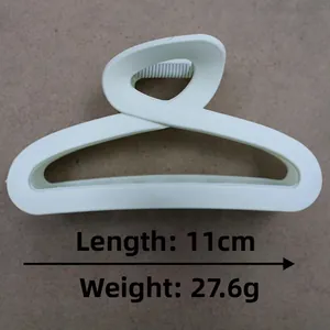 Detailed view of matte cream hair claw clip with 11cm length and 27.6g weight info